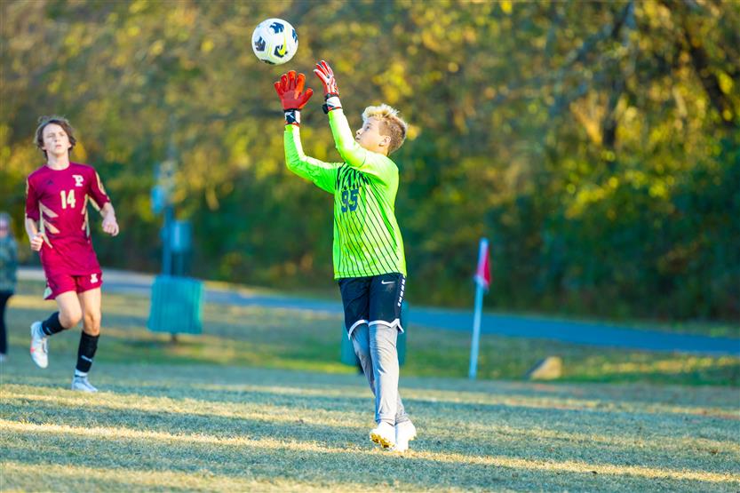 Middle school students play soccer